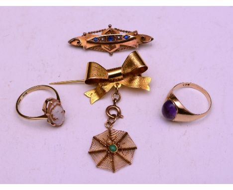 A nine carat gold bow brooch with spiders web pendant, decorated with seed pearl and turquoise stamped 375, 4 grams, also wit