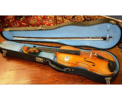 A Stradivarius copy violin with bow in fitted case, accessories in case, 60cm long