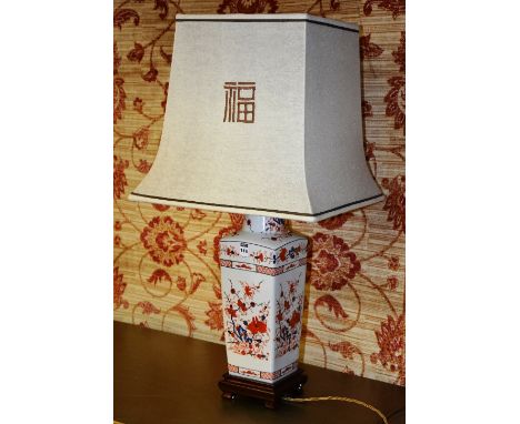 A modern Chinese type porcelain vase/table lamp, decorated with imari coloured foliate panels on white ground, with shade, 82