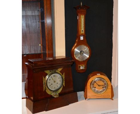 A stained wood mantel clock, with brass winged surmounts and silvered dial, 33cm high x 34cm wide, also with smiths mantel cl