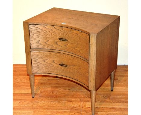 A contemporary light oak concave chest of drawers, with two drawers, 66cm high x 60cm wide x 45cm deep