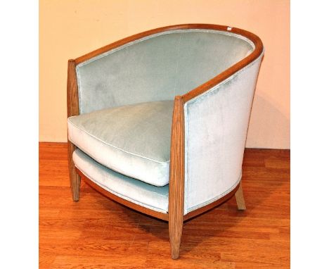 A contemporary light oak framed tub armchair, upholstered in pale green velour, matches previous lot, 78cm high x 74cm wide