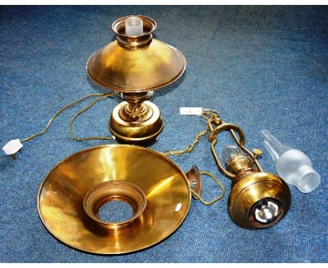 An oil lamp ceiling light, with glass funnel and chain attachment, approx 68cm high, also with similar oil lamp with brass re