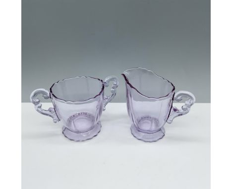 Exquisite duo of glassware donning a beautiful lavender color that includes a double handled open sugar cup, and a creamer ju