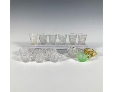 A charming collection featuring eight tiny Westmoreland Thumbelina teacups with a fan and diamond cut pattern, one of which i