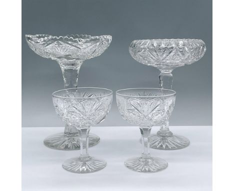 This brilliant cut glass 4 piece includes a tall pedestal bowl with a hobstar cane and saw tooth design, a tall compote with 