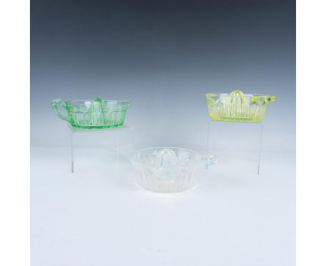 A delightful set of three transparent glass juicer reamers, each designed with a lovely handle and spout, is available in a c