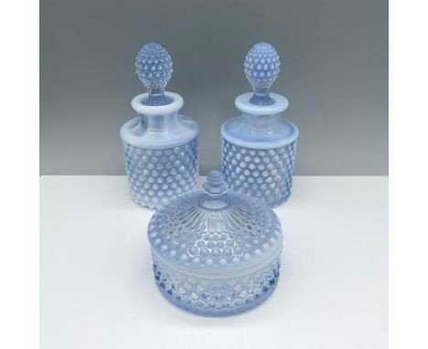 Splendid collection of glassware that includes two small decanters with stoppers, and one lidded round container. Largest ite
