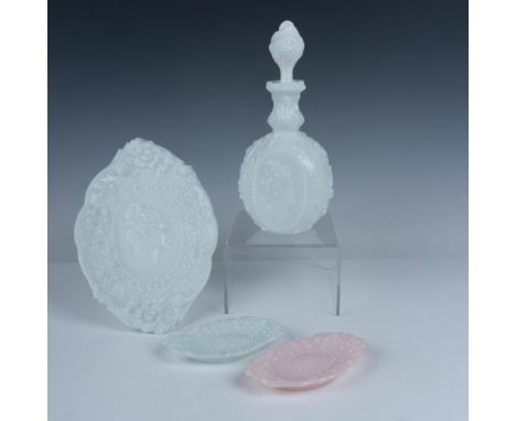 Beautiful collection of milk glass with raised embellishments and a portrait of a woman that consists of a decanter with a st