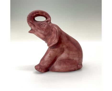 Precious elephant crafted from the original master mold #7024 designed in 1934. Finished in a maroon semi-matte glaze. Rookwo