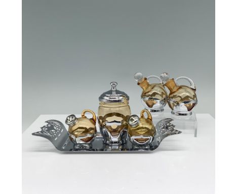 This classic collection includes two small decanters, two shakers, and a mustard jar with a lid, all complemented by a rectan
