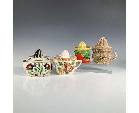 A delightful collection of pitchers with matching reamers, featuring fun figural shapes and hand-painted floral and fruit des
