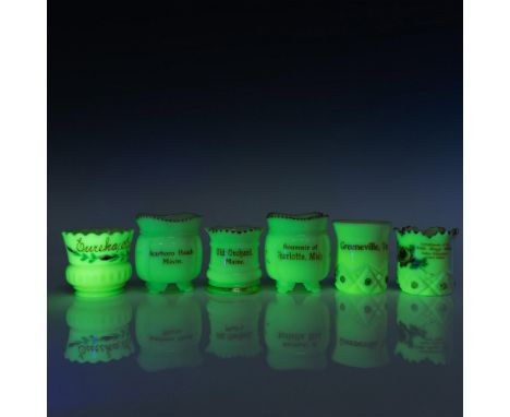 A delightful collection of six uranium glass toothpick holders showcasing unique pieces from Charlotte Michigan, Greenville T