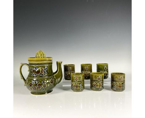 The set includes a juicer pitcher with reamer and six cups, designed with abundant fruits and flowers symbolizing prosperity 