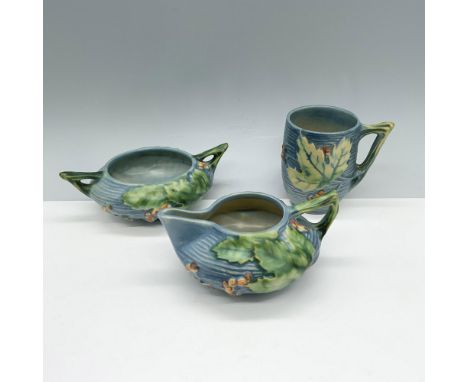 Fabulous blue ceramic collection that consists of a double handled sugar bowl, a wide bodied creamer jug, and a ridged body m