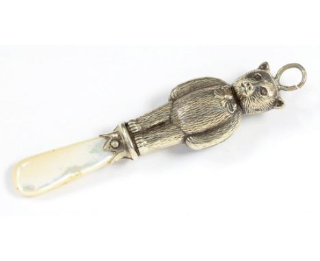 AN ELIZABETH II SILVER TEDDY BEAR NOVELTY BABY'S RATTLE WITH MOTHER OF PEARL HANDLE 8.5CM L CHESTER 1953