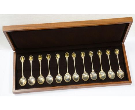 THE ROYAL SOCIETY FOR THE PROTECTION OF BIRDS SPOON COLLECTION.  A SET OF TWELVE ELIZABETH II PARCEL GILT SILVER TEASPOONS LO