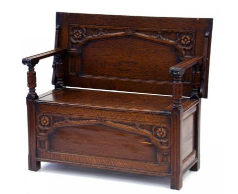 A 1930'S CARVED OAK MONK'S BENCH 107CM W