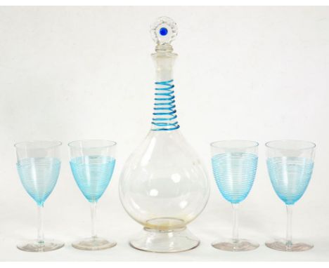 A BALUSTER GLASS DECANTER WITH TURQUOISE TRAILED DECORATION TO THE NECK AND ORIGINAL PINCERED STOPPER AND A SET OF FOUR WINE 