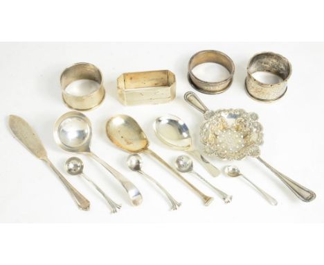 FOUR SILVER NAPKIN RINGS VARIOUS MAKERS AND DATES, A SILVER TEA STRAINER AND A SMALL QUANTITY OF SILVER FLATWARE INCLUDING CA