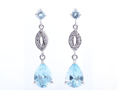Two round blue topaz gemstones are set in the stud with a drop of diamonds and two pear shaped blue topaz gemstones in these 