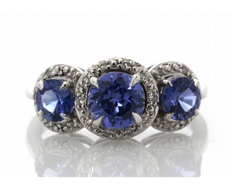 Three created Ceylon sapphires are each surrounded by a halo of diamonds in this stunning 9ct white gold three stone ring.Ite