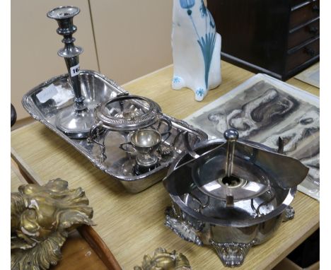 A large rectangular plated bread dish, a single plated Victorian candlestick and two plated spirit stands, a plated trophy cu