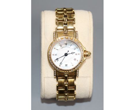 A lady's 18ct gold and diamond set Breguet wrist watch, (stones missing), with box and booklet.