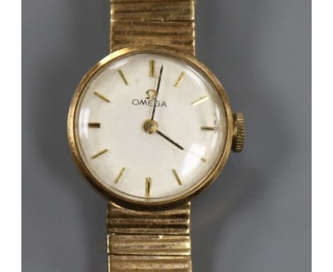 A lady's 9ct gold Omega manual wind wrist watch on 9ct gold Omega bracelet.