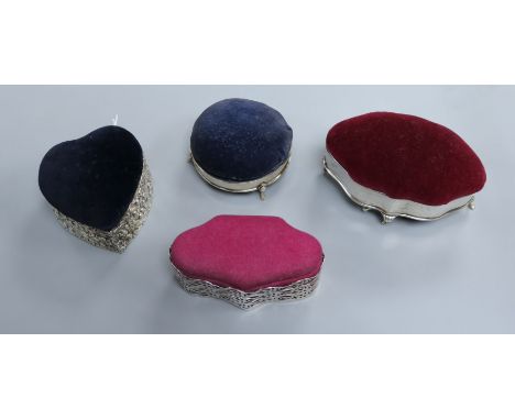 Four various silver-mounted trinket boxes with pin cushion tops, including a Victorian heart-shaped example (1895), W 13cm (l