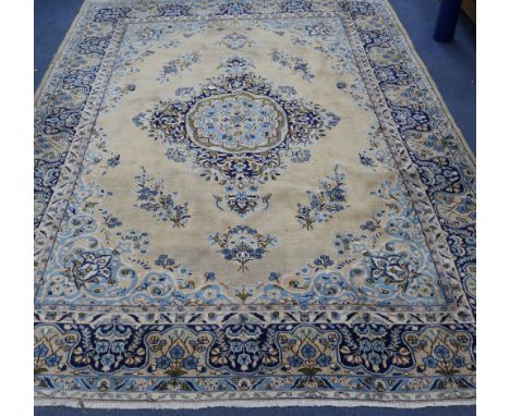 A Persian Kirman carpet 320 x 223cm