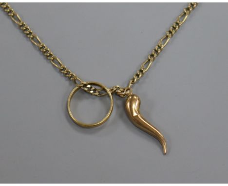 A 9ct gold chain hung with a 22ct gold band and a yellow metal horn of plenty charm.