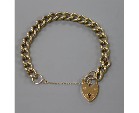 A 9ct gold curb link bracelet, with heart shaped padlock clasp.