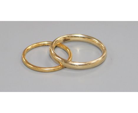 A 22ct. gold wedding band and a 9ct gold wedding band.