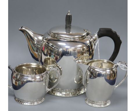 A silver three-piece tea service of oval form with panelled foot rims, gross 26.5 oz.