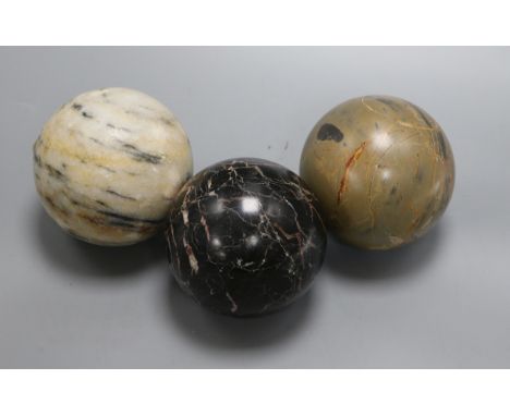 Three marble carpet balls