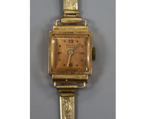 A lady's 18ct gold Ancre manual wind wrist watch, on a gilt metal bracelet.