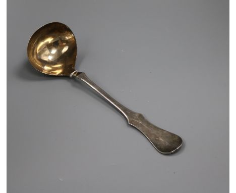 A German 800 white metal soup ladle.