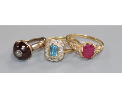 Two 9ct gold and gem set rings and a Victorian garnet and diamond ring.
