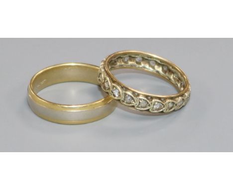 A two colour 18ct gold band and a 9ct gold and gem set ring.