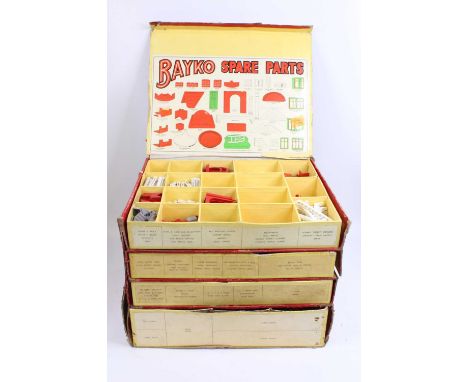 A Bayko 4 drawer retailer shop display cabinet comprising a thick card construction with slide out drawers, and a lift up lid