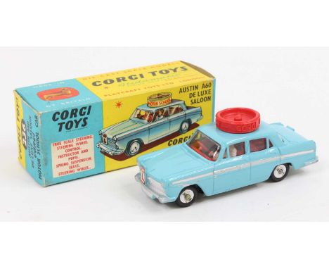 Corgi Toys No. 236 Motor School Car comprising of light blue body with red interior, and spun hubs with working steering mech