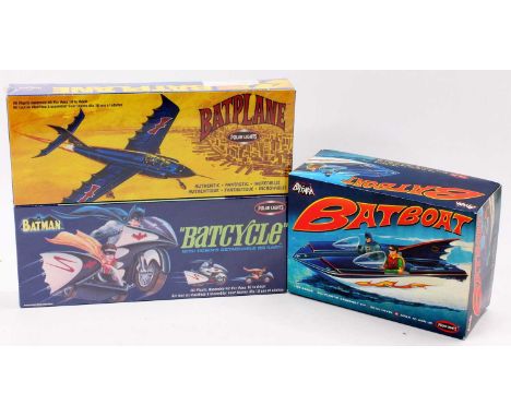 A Polar Lights boxed Batman 1/25 and similar scale kit group to include Bat Boat, Bat Cycle, and Bat Plane, all housed in ori