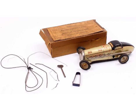 Tipp Co? tinplate and clockwork FL7 racing car, comprising gold and maroon body, with FL7 to the bonnett, plated hubs and bla