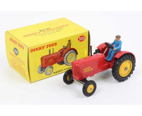 Dinky Toys No.300 Massey Harris tractor, comprising red body with yellow hubs (rear cast, the front are plastic), with blue d