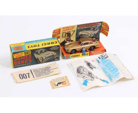 A Corgi Toys No. 261 James Bond Aston Martin DB5 comprising of gold body with red interior, working mechanisms and cast wire 