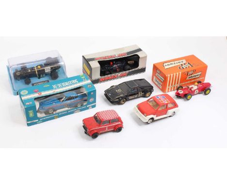 A collection of play-worn 1/32nd scale slot cars, with examples including a Scalextric No. C053 Datsun 260Z, No. C.133 Wolf W