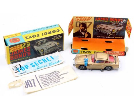 A Corgi Toys No. 261 James Bond Aston Martin DB5 comprising of gold body with red interior, working mechanisms and cast wire 