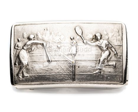 A white metal belt buckle embossed with a tennis match, circa 1920'srectangular, inscribed L.B.F. lower right corner, stamped