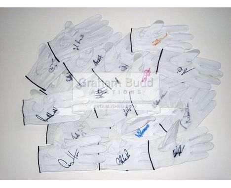 A collection of 46 signed white leather golf gloves,comprising Angel Cabrera, Doug Sanders, Tom Lehman x2, Vijay Singh, Micha